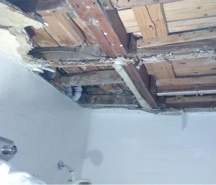exposed ceiling in a shower stall